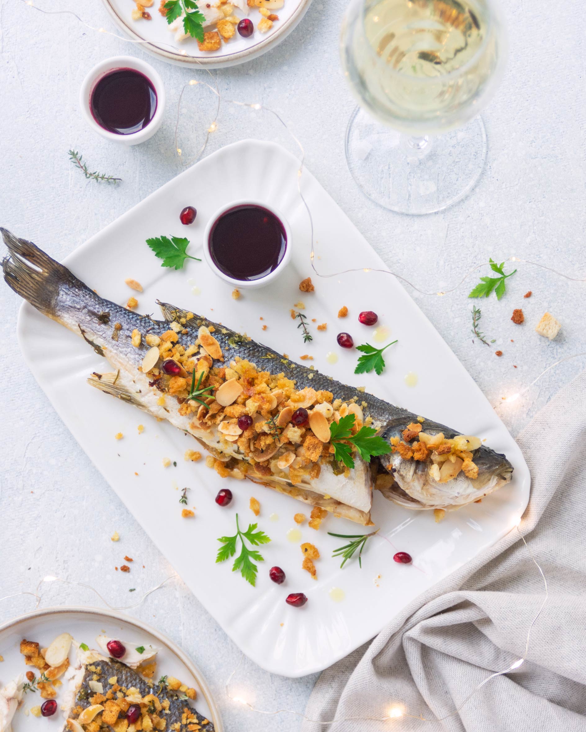 Branzino in crosta con coulis di melagrana